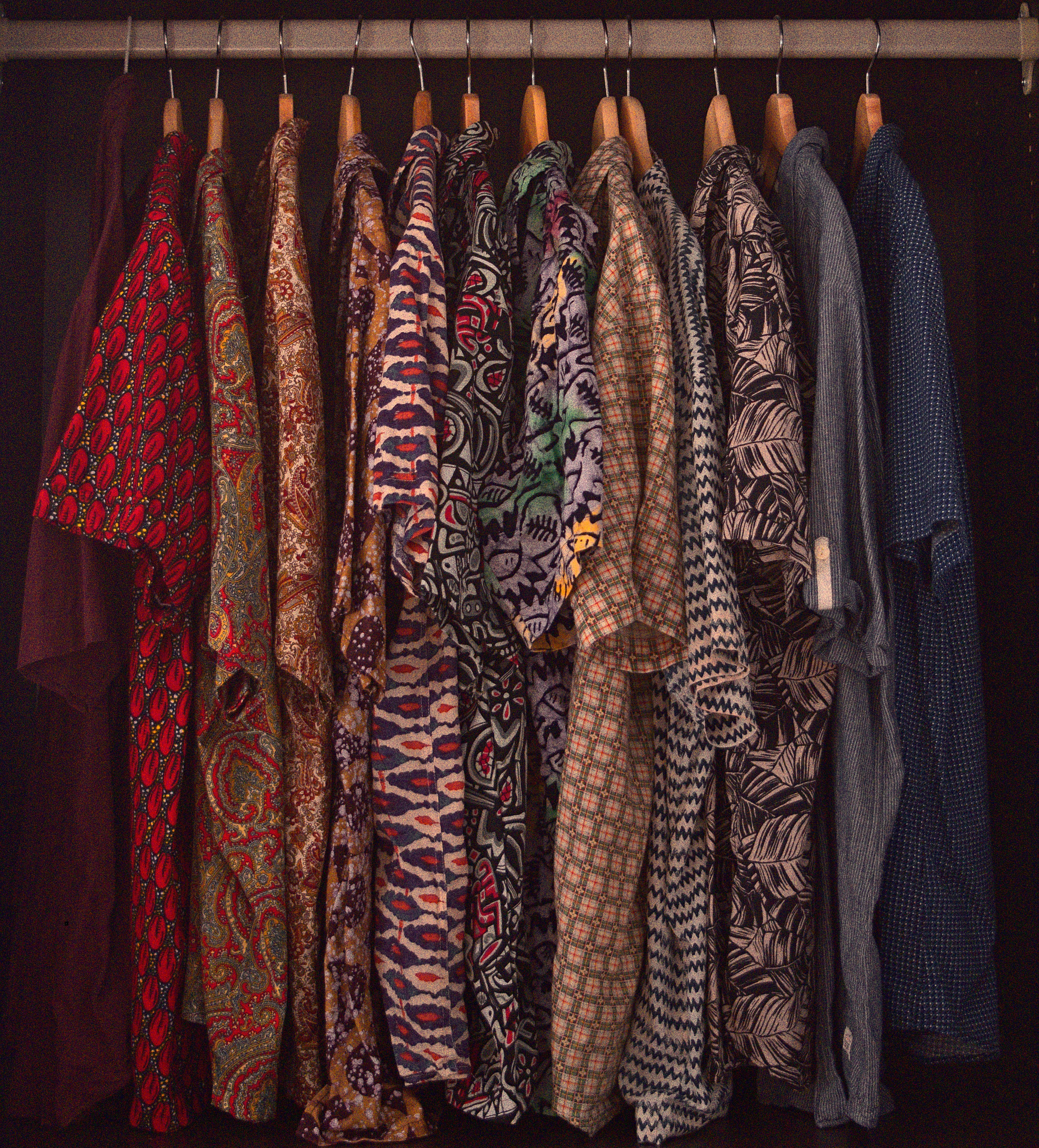 rack of aloha shirts hanging on hangers